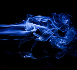 Blue smoke on black background