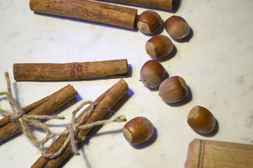 Cinnamon sticks and nuts, close up.