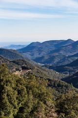 Mountain range landscape on a blue sky in Catalonian Pyrenees from a top view