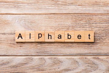 alphabet word written on wood block. alphabet text on wooden table for your desing, concept