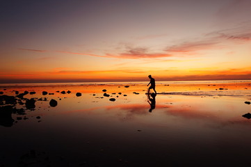 silhouette of man on beach