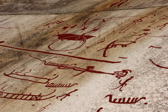 A prehistorical drawing in Sweden. Painting shows the boats, people and animals. 