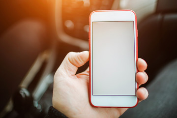 Man hand holding smartphone with empty mockup
