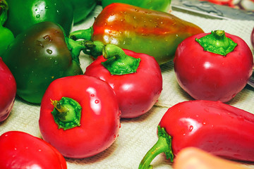 Bell peppers on a white towel in the kitchen