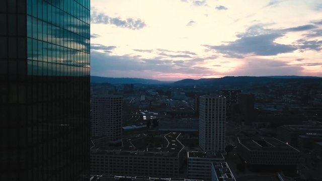 sunset aerial city view around skyscraper and train track