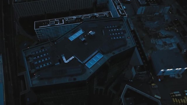night aerial city view around skyscraper and train track