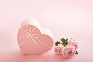 Valentine's day composition pink gift box with flowers. Valentine card. Greeting card template. Space for text. Concept of Happy Valentine's day. Mother's day card. Spring flowers on pink background