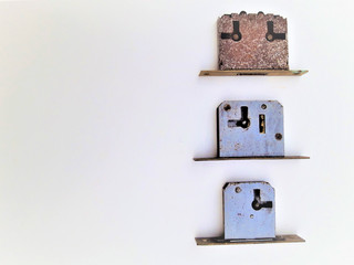 Three rusty locks on white background