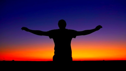 Mindful man enjoy freedom at sunset