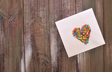 Naklejka na ściany i meble The envelope with a candy hearts. Concept Love.