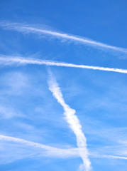 Fototapeta na wymiar white contrails left by airliners or are chemtrails