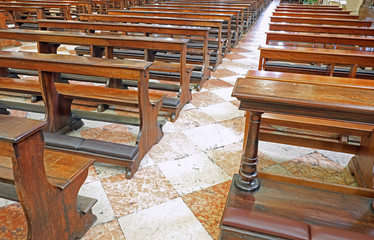 many wooden empty pews in the church