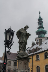 Fototapeta na wymiar Old city of Bratislava - historical statue and buildings and a vintage lamp