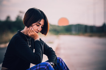 Fototapeta premium Portrait of beautiful asian chic girl pose for take a picture on wall background,Lifestyle of teen thailand people,Sad woman from love concept,