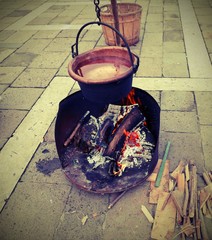 r cauldron over the fire made of burning woods and toned vintage