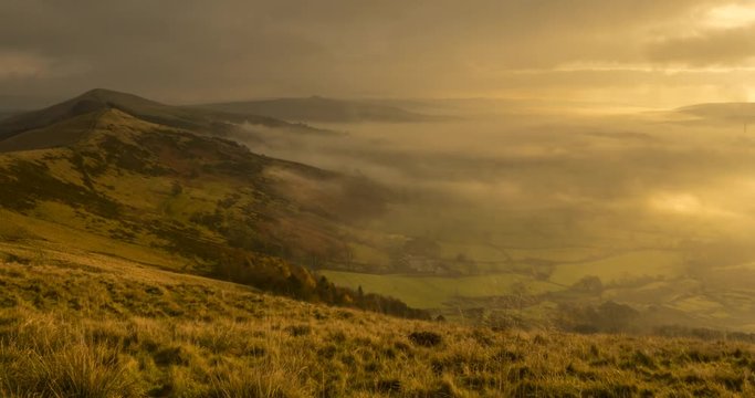 time lapse early morning mist lapping on Mam Tor, Castleton, Peak District National Park, Derbyshire, England, United Kingdom, Europe