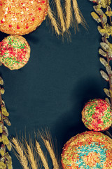 Easter bread with branches of willow on a monochrome blue background, texture