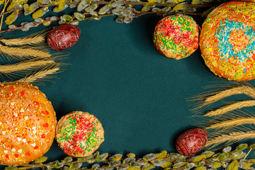 Easter bread with branches of willow on a monochrome blue background, texture