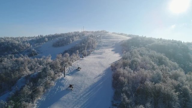 Epic Aerial shot: Two Snowcat's preparing slope at skiing resort. Beutiful Nature. 4k