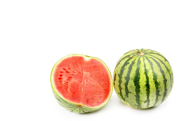 Ripe round watermelon and half berry isolated on white background. Free space for text.