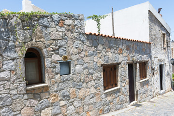house on a narrow street in the village of Krasi in Crete