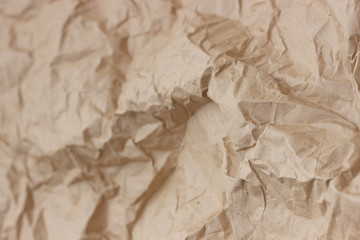 Brown wrinkle recycle paper background. Texture of crumpled paper. Texture of rumpled old paper close-up.