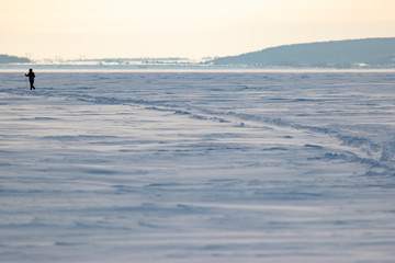 Man on a winter landscape doing Nordic walking