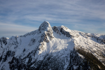Fototapeta na wymiar Beautiful view of the Lions peak during the winter time. Taken from Mnt Harvey, North of Vancouver, BC, Canada.