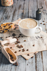 white Cup of cappuccino coffee with cinnamon
