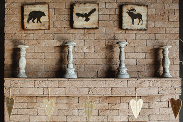 Background of textured brick wall with illustration of wild animals and old stone decoration. Valentines day concept.