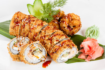 Japanese national popular cuisine. Sushi, rice and fish. Tasty, beautifully served food in a restaurant, cafe, with elements of the original design.