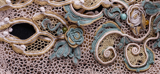 Crochet knitting. Lace of flowers.  Handmade Irish lace as a background