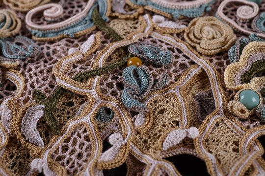 Crochet knitting. Lace of flowers.  Handmade Irish lace as a background