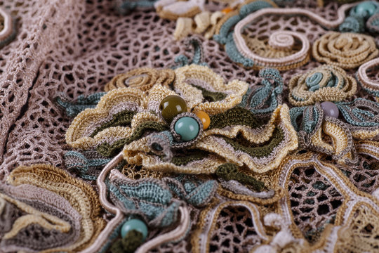 Crochet knitting. Lace of flowers.  Handmade Irish lace as a background