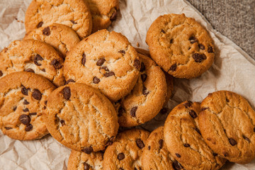 Chocolate chip cookies on wooden background. Sweet biscuits. Homemade pastry