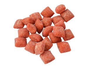 handful of pink chocolates isolate on white background