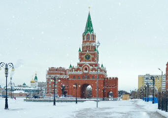Obraz premium winter urban landscape with snow from buildings and Orthodox Church