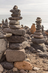 Fototapeta na wymiar Typicall Tenerife piles made from rocks on the beach