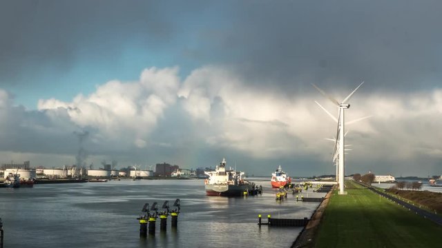 Timelapse of floating shadows, clouds, rainbow, windmills,in Port of Rotterdam Europoort