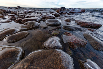 Icy stones on beach near lake Vattern 