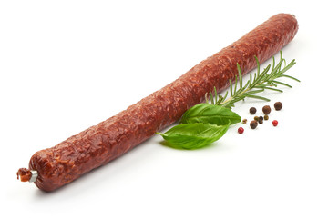 Thin salami sausage stick, close-up, isolated on white background
