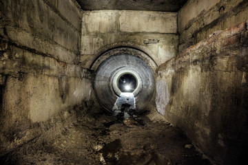 Underground urban sewage collector connected by round drainage sewer tunnel - obrazy, fototapety, plakaty