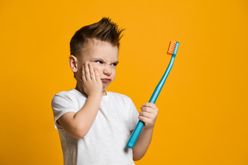 Little  boy suffering from toothache - Dental problem.