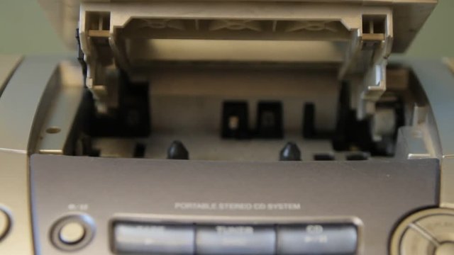 replacing audio cassettes in the player