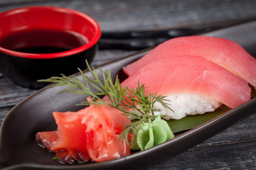 Japanese national popular cuisine. Sushi, rice and fish. Tasty, beautifully served food in a restaurant, cafe, with elements of the original design.