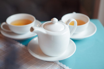 Naklejka na ściany i meble teapot with green tea for two people dinner