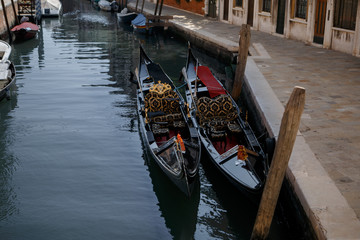 Fototapeta na wymiar two gondolas in love on a canal in Venice
