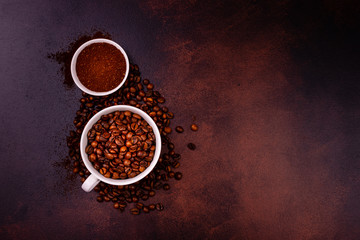 Seeds of fragrant coffee, coffee drink on a dark concrete background. It can be used as a background