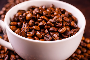 Seeds of fragrant coffee, coffee drink on a dark concrete background. It can be used as a background