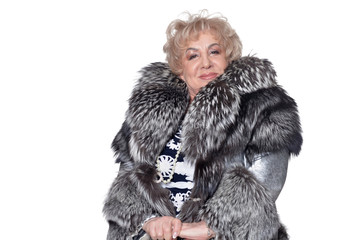 Portrait of senior woman in fur coat posing